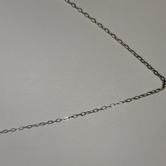 Bronze Coloured Thin Mini Textured Cross Pendent - Picture 2 of 3